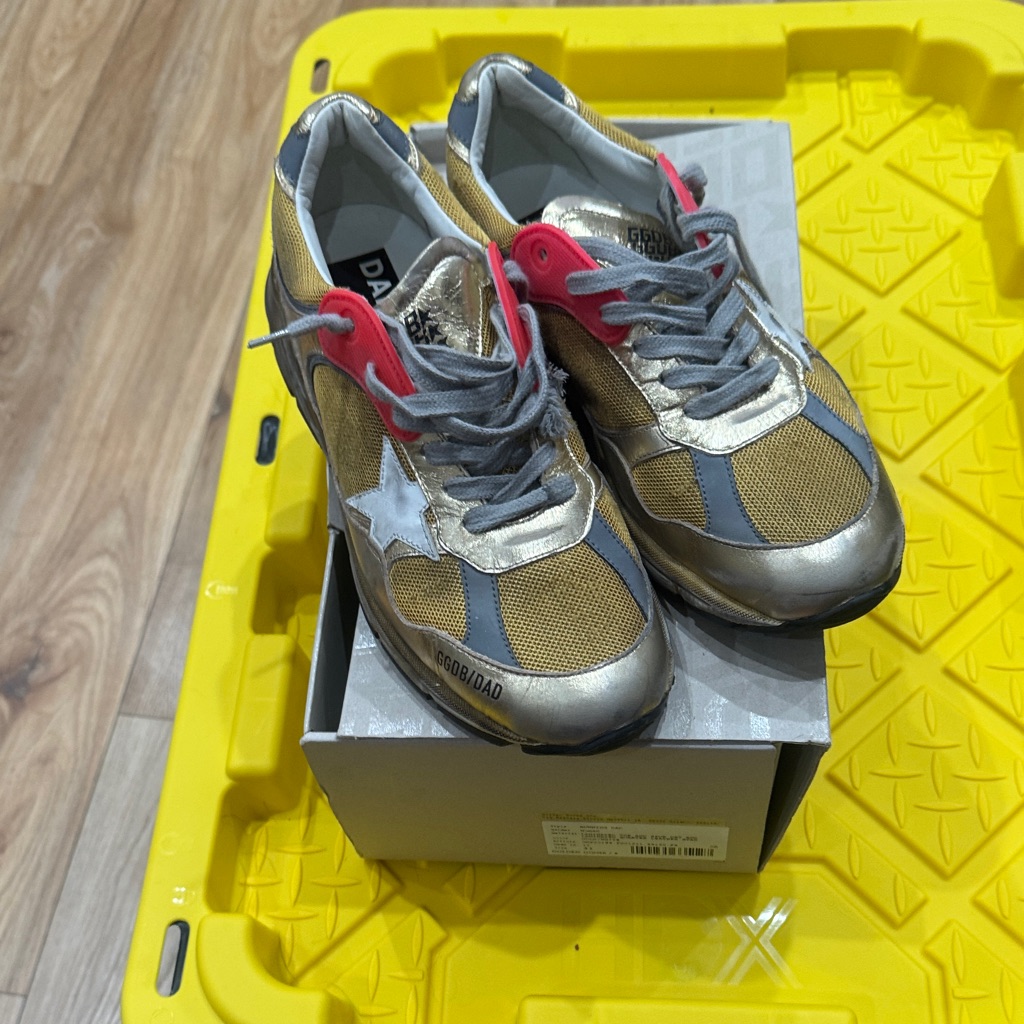 Golden Goose Dad Sneakers In Gold Colored Laminated Leather .